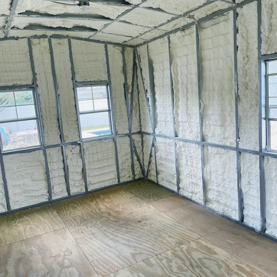 Closed-cell spray foam insulation applied to wall cavities in a residential project in Amity